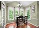 Dining area featuring bright windows, a table, and wooden floors at 5418 Amity Dr, Powder Springs, GA 30127