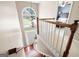 Open foyer with a chandelier, staircase, and a view of the front door and a bedroom at 5418 Amity Dr, Powder Springs, GA 30127