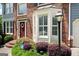 Close up showcasing a brick facade, bay window, and lush landscaping, creating a welcoming and picturesque curb appeal at 5418 Amity Dr, Powder Springs, GA 30127