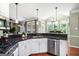 This modern kitchen provides stainless steel appliances, a dishwasher, and granite countertops at 5418 Amity Dr, Powder Springs, GA 30127