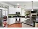A kitchen showcasing stainless steel appliances, a corner sink, and granite countertops at 5418 Amity Dr, Powder Springs, GA 30127