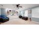 Spacious living room with built-in shelving, a comfortable chair, and natural light at 5418 Amity Dr, Powder Springs, GA 30127