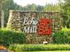 Stone sign with Echo Mill logo and well-manicured landscaping at 5418 Amity Dr, Powder Springs, GA 30127