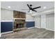 Cozy basement featuring a decorative stone fireplace and modern ceiling fan at 2106 Singer Way, Lithonia, GA 30058