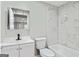 Bright bathroom with marble tile, white vanity, and modern fixtures at 2106 Singer Way, Lithonia, GA 30058