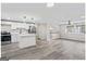 Open-concept kitchen with stainless steel appliances and island, flowing into the living area at 2106 Singer Way, Lithonia, GA 30058