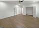Spacious bedroom features wood floors, white walls, and a modern ceiling fan at 243 Roxbury Dr, Riverdale, GA 30274
