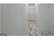 Hallway with marble floors, white walls, and doors at 243 Roxbury Dr, Riverdale, GA 30274