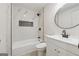 Updated bathroom features a tub/shower combination with modern tiling and black fixtures at 4451 Flat Shoals, Decatur, GA 30034