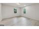 Clean bedroom with contemporary floors, neutral paint, and natural light from the windows at 4451 Flat Shoals, Decatur, GA 30034