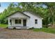 Charming single-story home featuring a welcoming porch and a freshly painted exterior at 4451 Flat Shoals, Decatur, GA 30034