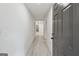 Hallway with modern flooring and neutral paint, great for showcasing the home's layout at 4451 Flat Shoals, Decatur, GA 30034