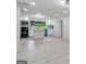 Bright and open living space, connected to a modern kitchen, featuring new flooring and neutral paint at 4451 Flat Shoals, Decatur, GA 30034