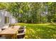 Spacious backyard perfect for outdoor dining, and entertaining, surrounded by lush greenery at 6200 Beaver Creek Trl, Atlanta, GA 30349