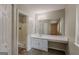 Clean bathroom with tiled shower, vanity, sink, and storage at 6200 Beaver Creek Trl, Atlanta, GA 30349
