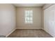 Cozy bedroom with soft carpet, a window, and a closet for ample storage at 6200 Beaver Creek Trl, Atlanta, GA 30349