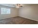 Relaxing bedroom with carpet, a ceiling fan, and a window to let the sunshine in at 6200 Beaver Creek Trl, Atlanta, GA 30349
