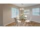 Bright dining area with modern chandelier, glass table and windows, perfect for Gathering meals at 6200 Beaver Creek Trl, Atlanta, GA 30349