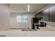 Cozy kitchen featuring dark cabinets, stainless steel appliances, and a convenient breakfast bar at 6200 Beaver Creek Trl, Atlanta, GA 30349