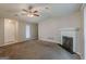 Spacious living room with plush carpeting and a cozy fireplace, perfect for relaxing evenings at 6200 Beaver Creek Trl, Atlanta, GA 30349