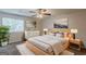 Comfortable main bedroom with a ceiling fan, natural light, and neutral decor at 6200 Beaver Creek Trl, Atlanta, GA 30349