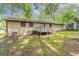 This backyard features a wooden deck perfect for entertaining, set against a classic brick home exterior at 1105 Buckhurst Dr, Atlanta, GA 30349