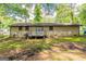 Brick home's backyard has a wood deck and yard with privacy and room for outdoor activities at 1105 Buckhurst Dr, Atlanta, GA 30349