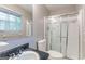 Bathroom with a shower/tub combo, a sink, a toilet, and a window for natural lighting at 1105 Buckhurst Dr, Atlanta, GA 30349