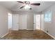 Bedroom with carpeted flooring, a ceiling fan, closet space, and access to the bathroom at 1105 Buckhurst Dr, Atlanta, GA 30349