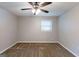 Cozy bedroom featuring a ceiling fan, a window, neutral paint, and carpeted floors at 1105 Buckhurst Dr, Atlanta, GA 30349