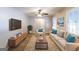 Bright living room features a cozy sofa, armchair, stylish decor, and natural light from large windows at 1105 Buckhurst Dr, Atlanta, GA 30349
