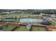Aerial view of community amenities, featuring a pool, playground, tennis courts, and clubhouse at 2159 Redfern, Dacula, GA 30019