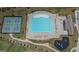 Aerial view of community amenities including a pool, pickleball court, clubhouse, and playground at 2159 Redfern, Dacula, GA 30019