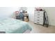 Cozy bedroom featuring a study desk, modern dresser, and neutral carpet flooring at 2159 Redfern, Dacula, GA 30019