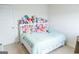 Bright bedroom with a large bed, built-in storage, and a playful display of plush toys at 2159 Redfern, Dacula, GA 30019