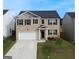 Charming two-story home featuring a brick facade, well-manicured lawn, and a two-car garage, perfect for families at 2159 Redfern, Dacula, GA 30019