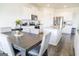 Bright kitchen and dining area with granite countertops, stainless steel appliances, and a dining table at 2159 Redfern, Dacula, GA 30019