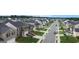 Aerial view showing a well-maintained street with sidewalks and landscaped front yards at 2159 Redfern, Dacula, GA 30019