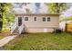 Back of home with a stairway to the back door and neutral siding at 2245 Dauphine St, Atlanta, GA 30344