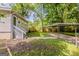 Home backyard with a carport, a fenced yard, and a stairway to the back door at 2245 Dauphine St, Atlanta, GA 30344
