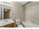Bathroom featuring vanity, mirror with lighting, toilet, and a shower/tub combination at 2245 Dauphine St, Atlanta, GA 30344