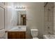 Clean bathroom featuring a vanity, mirror with lights, toilet, and shower/tub combination at 2245 Dauphine St, Atlanta, GA 30344