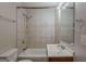 Bathroom featuring tile walls, a bathtub, a toilet, and vanity with sink at 2245 Dauphine St, Atlanta, GA 30344