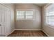 Bedroom with a closet, a light colored wall, and large windows at 2245 Dauphine St, Atlanta, GA 30344