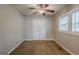 Bedroom with carpet floors, ceiling fan, and a double window providing natural light at 2245 Dauphine St, Atlanta, GA 30344
