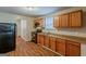Functional kitchen with wood cabinets, black appliances, and laminate countertops at 2245 Dauphine St, Atlanta, GA 30344
