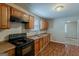 Well-equipped kitchen featuring wood cabinets and a functional layout at 2245 Dauphine St, Atlanta, GA 30344