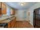 Spacious kitchen with wood cabinets, black appliances, and ample counter space at 2245 Dauphine St, Atlanta, GA 30344