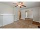 Living room with carpet floors, featuring a decorative fireplace and entryways to other rooms at 2245 Dauphine St, Atlanta, GA 30344