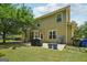 Spacious backyard featuring a patio, tree, and basketball hoop at 826 Richmond Cir, Peachtree City, GA 30269